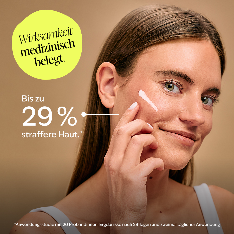 Eine Ärztin hält eine Tube PHYSIOGEL Creme und spricht von bis zu 39% mehr Hautfeuchtigkeit.