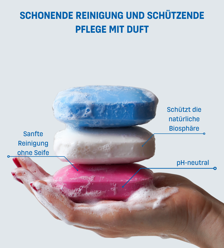 Drei Fest Waschstücke in verschiedenen Farben. Text: SCHONENDE REINIGUNG UND SCHÜTZENDE PFLEGE MIT DUFT.
